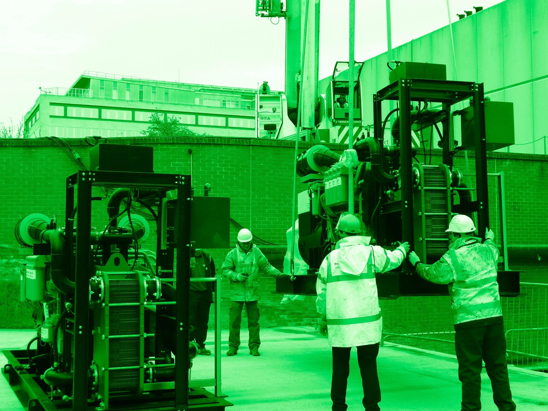 Site team working safely around plant equipment on a construction site