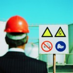 Man looking at safety sign